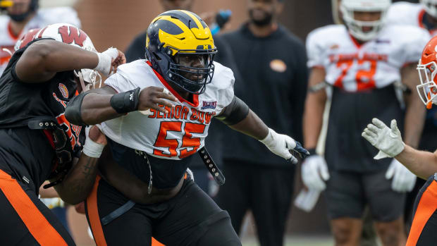 Feb 2, 2023; Mobile, AL, USA; National offensive lineman Olusegun Oluwatimi of Michigan (55) practices during the third day of Senior Bowl week at Hancock Whitney Stadium in Mobile.