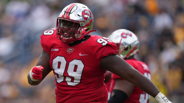 Dec 18, 2021; Boca Raton, Florida, USA; Western Kentucky Hilltoppers defensive tackle Brodric Martin (99) celebrates after making a tackle against the Appalachian State Mountaineers during the second half in the 2021 Boca Raton Bowl at FAU Stadium.
