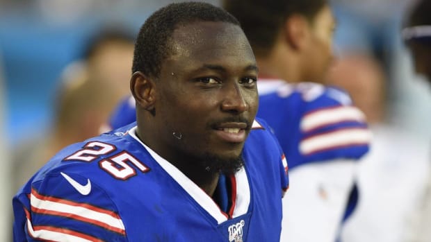 Bills running back LeSean McCoy looks on without a helmet during a game.