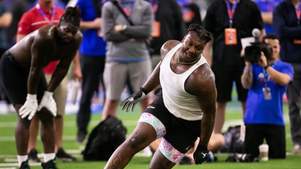Florida Gators defensive lineman Gervon Dexter Sr. (9) drops a rolled towel while running a drill during the 2023 NFL Pro Day held at Condron Family Indoor Practice Facility in Gainesville, FL on Thursday, March 30, 2023.