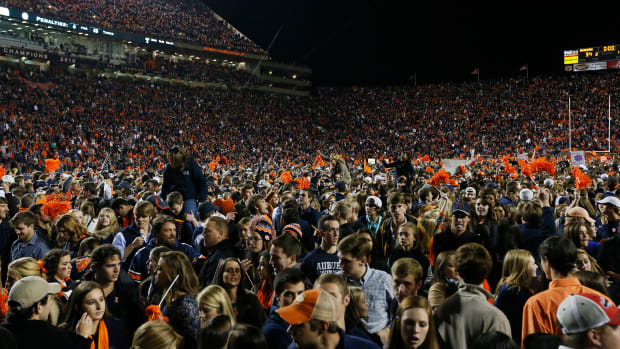 AUBURN, AL - NOVEMBER 30: Fans take the field to celebrate with the Auburn Tigers after they defeated the Alabama Crimson Tide 34 to 28 at Jordan-Hare Stadium on November 30, 2013 in Auburn, Alabama. (Photo by Kevin C. Cox/Getty Images)