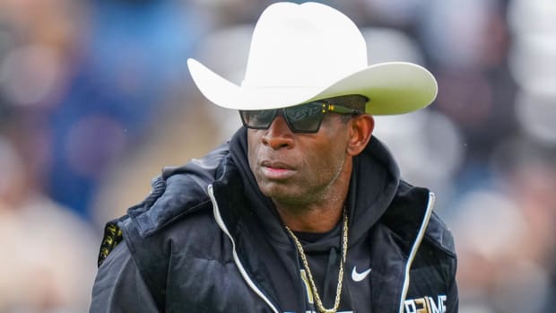 Colorado coach Deion Sanders on the field at the Buffaloes' spring game.