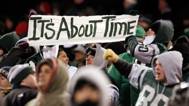 Jets' Fans hold up "It's About Time" sign in 2010
