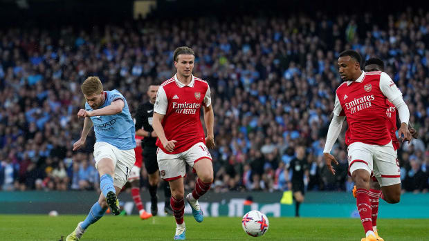Kevin De Bruyne pictured (left) scoring for Manchester City against Arsenal in the Premier League in April 2023