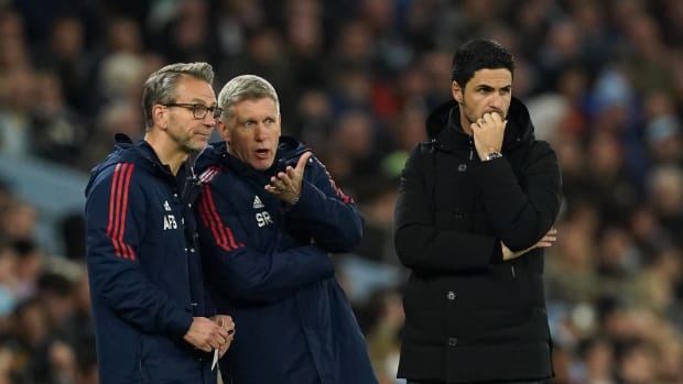 Arsenal manager Mikel Arteta pictured (right) with assistants Albert Stuivenberg (left) and Steve Round on the touchline during the team's 4-1 defeat at Manchester City in April 2023
