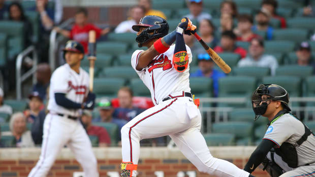 Apr 25, 2023; Atlanta, Georgia, USA; Atlanta Braves right fielder Ronald Acuna Jr. (13) hits a double against the Miami Marlins in first inning at Truist Park.