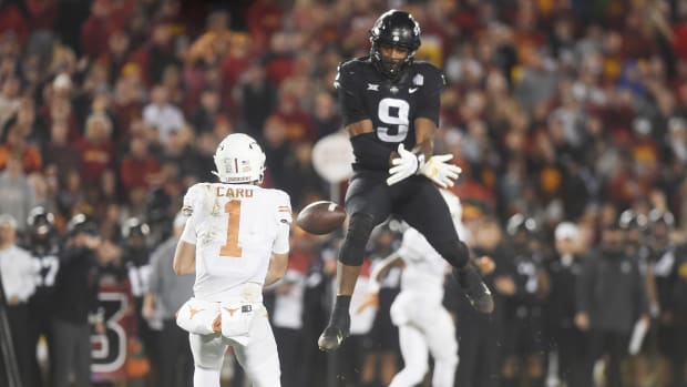 Iowa State's Will McDonald leaps high into the air