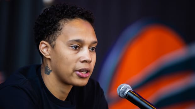 Phoenix Mercury superstar Brittney Griner speaking into a microphone during a press conference