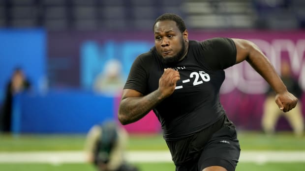 Ohio State tackle Dawand Jones runs through a drill at the 2023 NFL Combine
