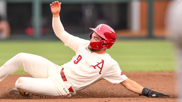 Razorbacks' John Bolton slides into second base during win over Texas A&M on Saturday