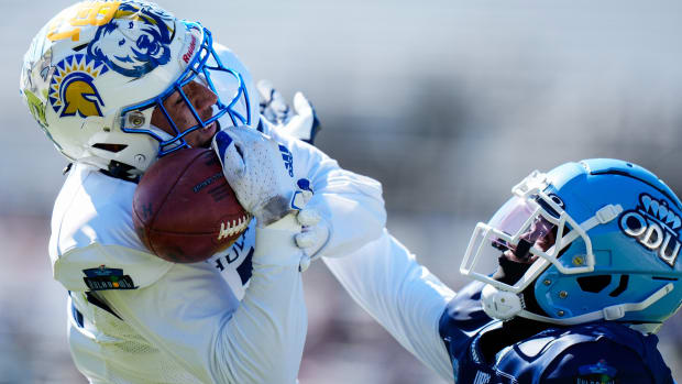Jan 14, 2023; Orlando, FL, USA; Team Kai wide receiver Elijah Cooks (11) of the San Jose State Spartans catches a pass as Team Aina cornerback Tre Hawkins (28) of the Old Dominion Monarchs defends during the second quarter in the 2023 Hula Bowl at UCF FBC Mortgage Stadium.