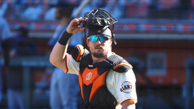 SF Giants catcher Tyler Heineman reacts as a play is announced as under review. (2020)