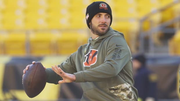Bengals quarterback Brandon Allen (8) warms up before the game against the Steelers at Acrisure Stadium.