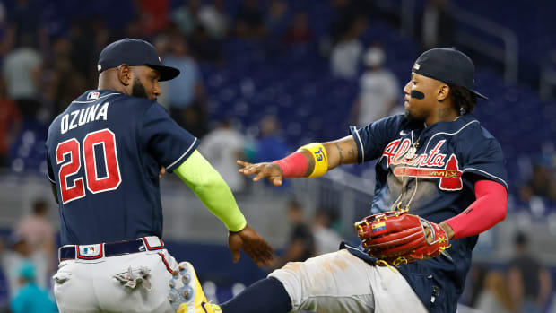 May 2, 2023; Miami, Florida, USA; Atlanta Braves designated hitter Marcell Ozuna (20) and right fielder Ronald Acuna Jr. celebrate following the ninth inning the Miami Marlins at loanDepot Park. Mandatory Credit: Rhona Wise-USA TODAY Sports