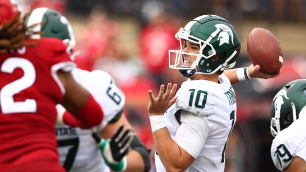 PISCATAWAY, NJ - OCTOBER 09 : Quarterback Payton Thorne #10 of the Michigan State Spartans attempts a pass during the third quarter of a game against the Rutgers Scarlet Knights at SHI Stadium on October 9, 2021 in Piscataway, New Jersey. Michigan State defeated Rutgers 31-13. (Photo by Rich Schultz/Getty Images)