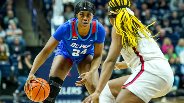 DePaul forward Aneesah Morrow dribbles the ball against UConn forward Aaliyah Edwards in the second half at Harry A. Gampel Pavilion.