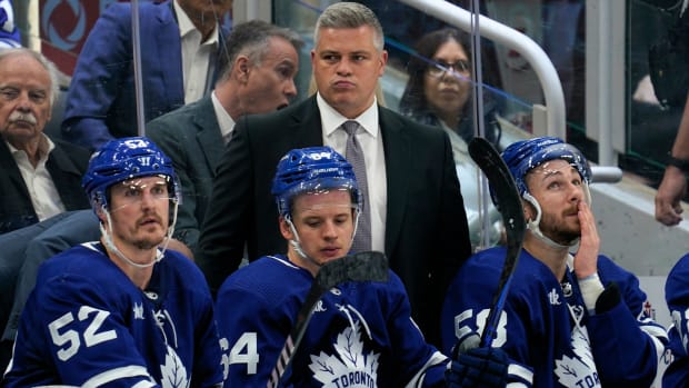 Dejected Maple Leafs players on the bench during their loss to the Panthers