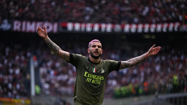 AC Milan left-back Theo Hernandez pictured celebrating after scoring a stunning goal against Lazio in May 2023