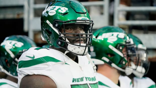 FILE - New York Jets offensive tackle Mekhi Becton waits to take the field before an NFL preseason football game against the New York Giants, Aug. 14, 2021, in East Rutherford, N.J. The New York Jets declined the fifth-year option on offensive tackle Becton’s contract, according to a person familiar with the decision. It was an expected choice by the Jets, who had until Tuesday, May 2, 2023, afternoon to pick up the option if they chose to do so. (AP Photo/Frank Franklin II, File)