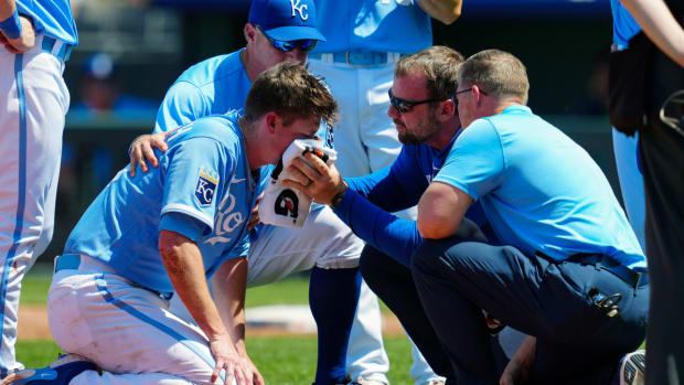 May 7, 2023; Kansas City, Missouri, USA; Kansas City Royals relief pitcher Ryan Yarbrough (48) is attended to by medical staff after being hit by a line drive off the bat of Oakland Athletics first baseman Ryan Noda (not pictured) during the sixth inning at Kauffman Stadium. Mandatory Credit: Jay Biggerstaff-USA TODAY Sports