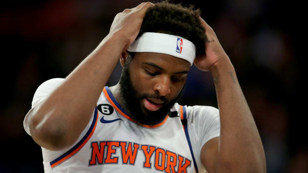 Knicks center Mitchell Robinson puts his hands on his head during Game 1 against Heat