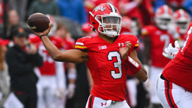Maryland Terrapins quarterback Taulia Tagovailoa attempts a pass during a college football game in the Big Ten.