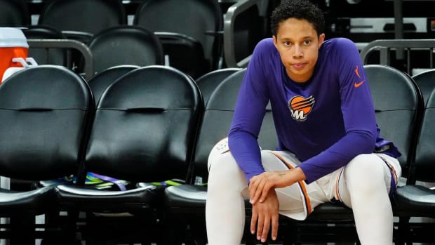 Phoenix Mercury forward Brittney Griner sits on the bench before a WNBA preseason game.