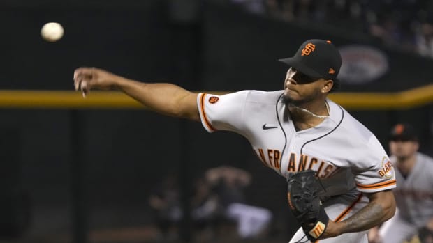 SF Giants relief pitcher Camilo Doval throws to close out a ninth inning in Arizona (2023).