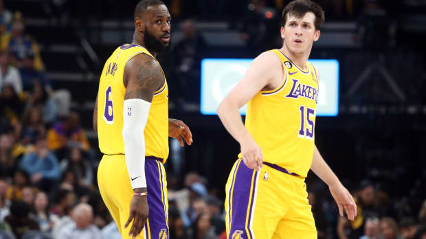 Los Angeles Lakers forward LeBron James (6) and Los Angeles Lakers guard Austin Reaves (15) react during the first half against the Memphis Grizzlies during game five of the 2023 NBA playoffs at FedExForum.