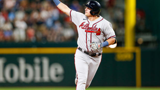 May 15, 2023; Arlington, Texas, USA; Atlanta Braves third baseman Austin Riley (27) points as he circles the bases after hitting a two-run home run during the seventh inning against the Texas Rangers at Globe Life Field.
