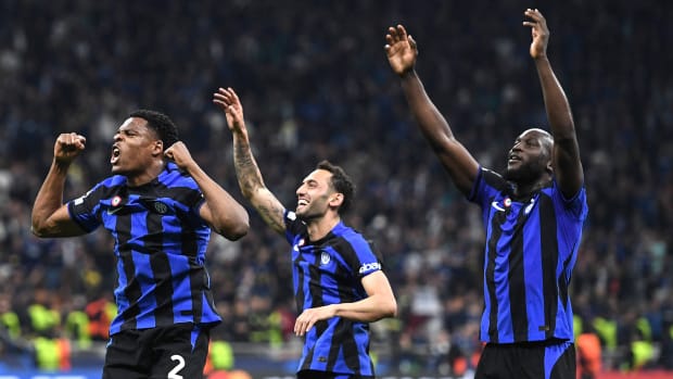 Denzel Dumphries (left), Hakan Calhanoglu (middle) and Romelu Lukaku celebrate Inter’s UCL win over AC Milan.