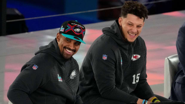 Jalen Hurts and Patrick Mahomes sitting next to each other at Super Bowl Opening Night.
