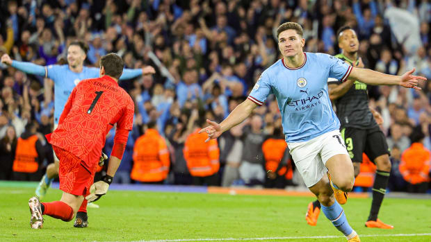 Julian Alvarez of Manchester City scores a goal and celebrates during the Champions League.