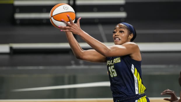 May 27, 2021; College Park, Georgia, USA; Dallas Wings forward/center Charli Collier (35) catches a pass under the basket against the Atlanta Dream during the first half at Gateway Center Arena at College Park.