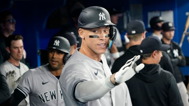 May 16, 2023; Toronto, Ontario, CAN; New York Yankees designated hitter Aaron Judge (99) celebrates in the dugout after hitting a two run home run against the Toronto Blue Jays during the eighth inning at Rogers Centre.