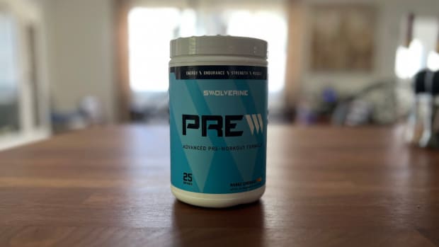 A white container with a large light blue label of Swolverine preworkout