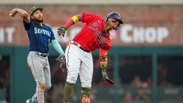 May 19, 2023; Cumberland, Georgia, USA; Atlanta Braves right fielder Ronald Acuna Jr. (13) reacts after hitting a double against the Seattle Mariners during the first inning at Truist Park.