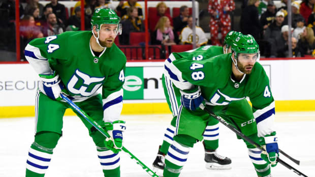 Hurricanes players in throwback Hartford Whalers jerseys.