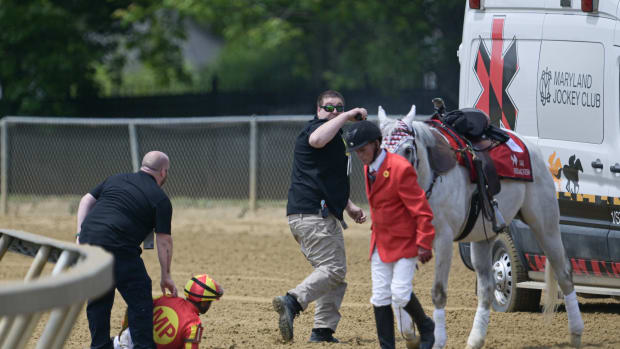 May 20, 2023; Baltimore, Maryland, USA; Medical personal tend to jockey Luis Saez after falling off Havnameltdown during the he 48th Running the Chick Lang Stakes (Grade III)at Pimlico Race Course.