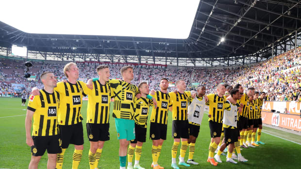Players from Borussia Dortmund pictured celebrating after winning 3-0 at Augsburg to go top of the Bundesliga table on the penultimate weekend of the 2022/23 season