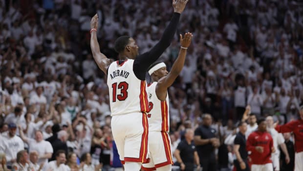 Miami Heat center Bam Adebayo (13) and forward Jimmy Butler (22) react after a play during the third quarter against the Boston Celtics in game three of the Eastern Conference Finals for the 2023 NBA playoffs at Kaseya Center.