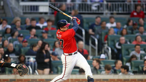 May 5, 2023; Atlanta, Georgia, USA; Atlanta Braves third baseman Austin Riley (27) hits a single against the Baltimore Orioles in the third inning at Truist Park.