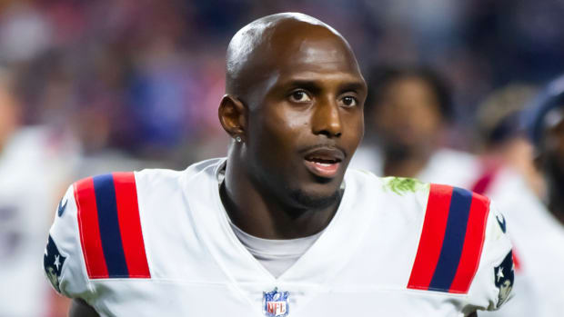 Former Patriots defensive back Devin McCourty runs off the field after a game in 2022.