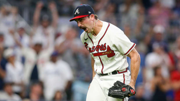Jun 26, 2022; Atlanta, Georgia, USA; Atlanta Braves starting pitcher Spencer Strider (65) reacts after a strikeout against the Los Angeles Dodgers in the sixth inning at Truist Park.