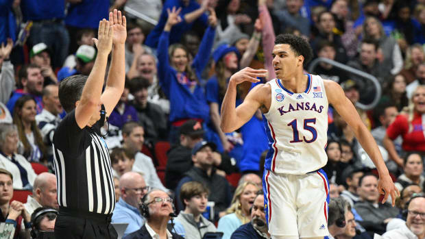 Mar 18, 2023; Des Moines, IA, USA; Kansas Jayhawks guard Kevin McCullar Jr. (15) reacts after a basket against the Arkansas Razorbacks during the second half at Wells Fargo Arena.