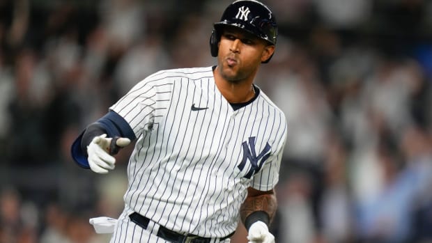 New York Yankees’ Aaron Hicks gestures to teammates as he runs the bases after hitting a two-run home run during the seventh inning of a baseball game against the Oakland Athletics, Monday, May 8, 2023, in New York. (AP Photo/Frank Franklin II)