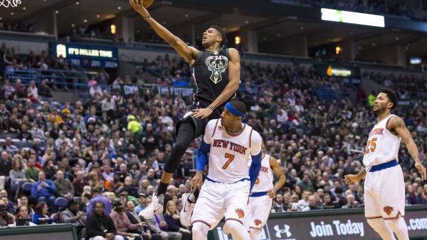 Milwaukee Bucks forward Giannis Antetokounmpo (34) shoots over New York Knicks forward Carmelo Anthony (7)