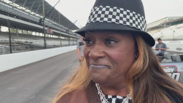 Robin Matthews has a great attitude after her car is slammed by a wayward wheel in Sunday's Indianapolis 500. Photo courtesy WTHR TV, Channel 13, Indianapolis.