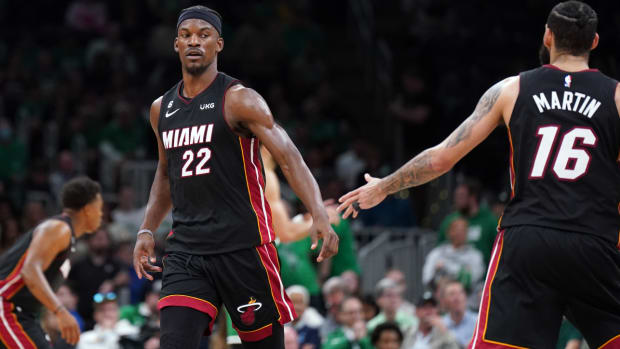 May 29, 2023; Boston, Massachusetts, USA; Miami Heat forward Jimmy Butler (22) celebrates with forward Caleb Martin (16) in the fourth quarter against the Boston Celtics during game seven of the Eastern Conference Finals for the 2023 NBA playoffs at TD Garden. Mandatory Credit: David Butler II-USA TODAY Sports