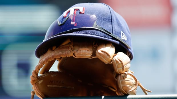 May 29, 2023; Detroit, Michigan, USA; Texas Rangers cap and glove in the dugout in the first inning against the Detroit Tigers at Comerica Park. Mandatory Credit: Rick Osentoski-USA TODAY Sports